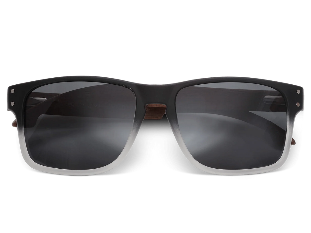 Black sunglasses with dark lenses on a white background