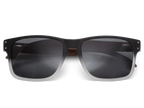 Black sunglasses with dark lenses on a white background
